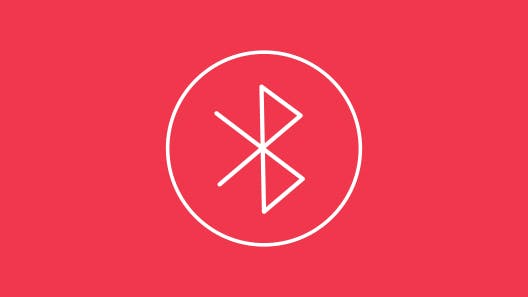 White outline of bluetooth connection icon on red background.